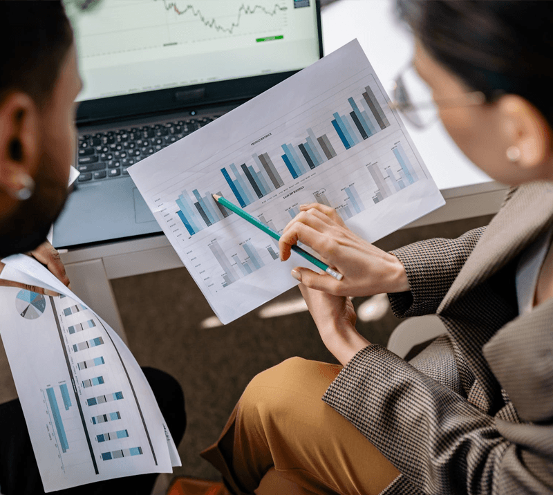 researchers looking at a chart