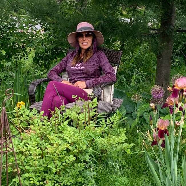 Woman sitting in her garden.