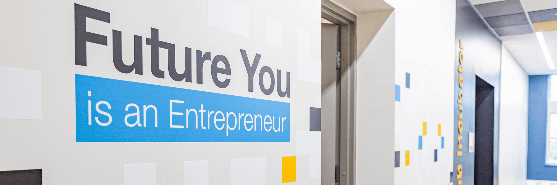 Future You Is an Entrepreneur text on a wall