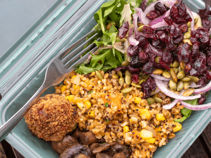 an assortment of plant based items in a green container