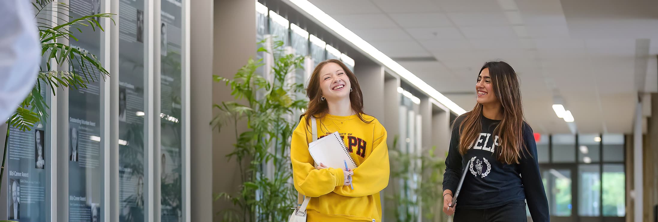 2 students walking down the hall