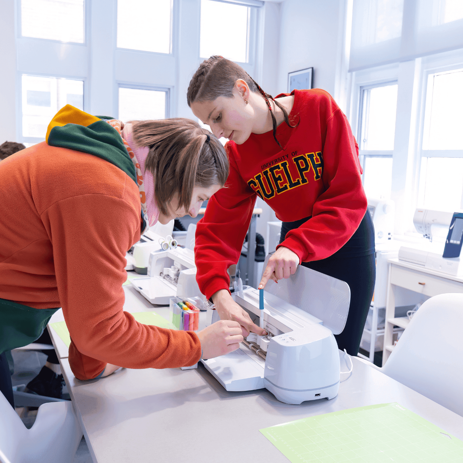 2 students using Cricut Machine